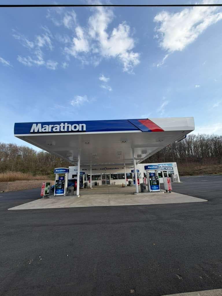 Marathon canopy under wide blue sky at Blue Mountain Travel Center