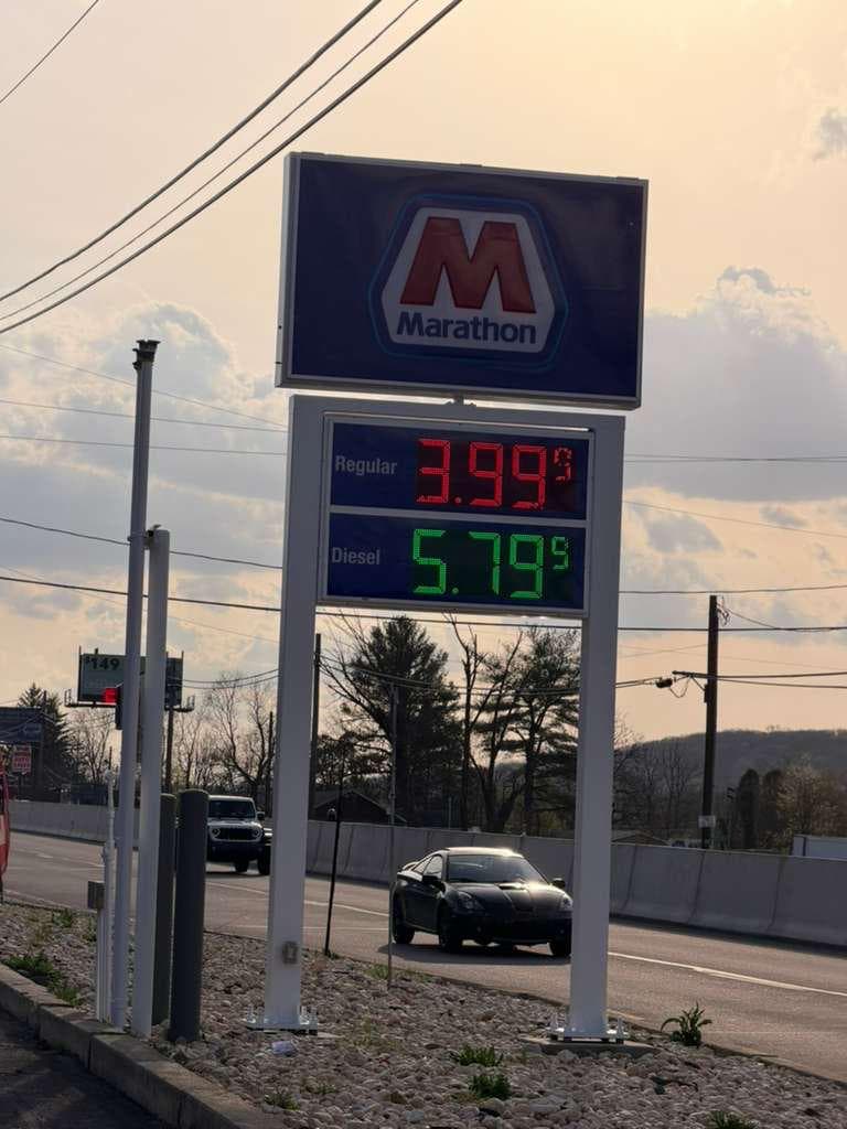 Marathon roadside price sign at sunset
